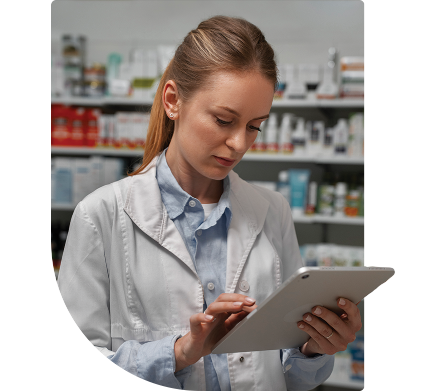 calgary pharmacist looking at tablet