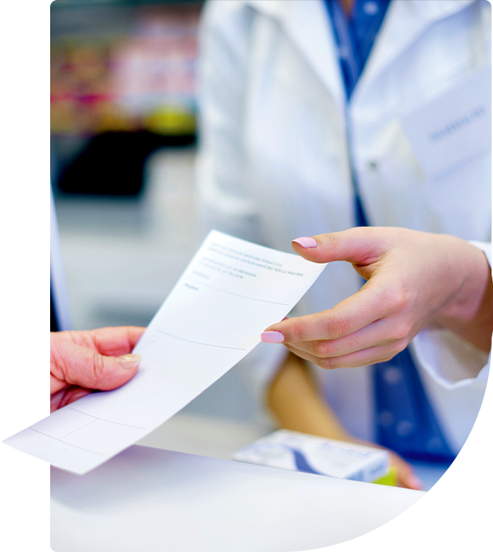 Calgary pharmacist handing patient paper