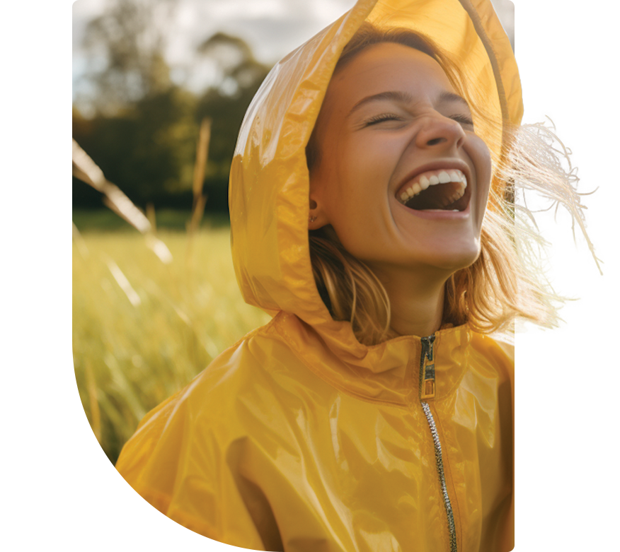 A smiling woman in a rain coat