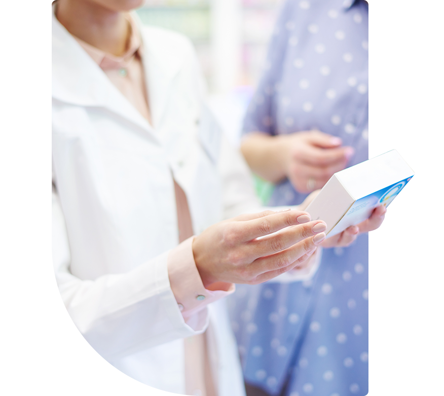 woman holding a box of medication