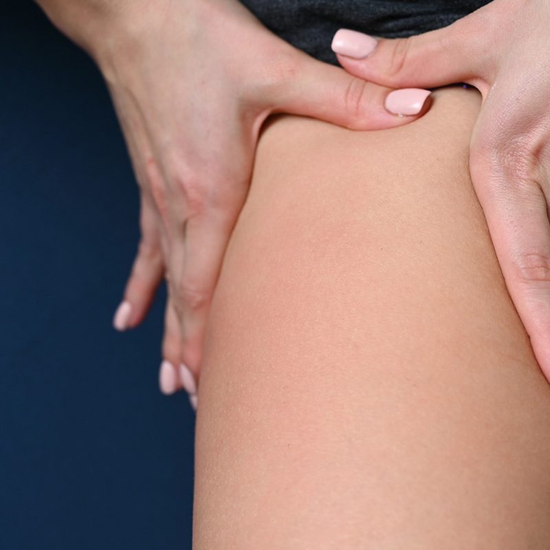 someone massaging a persons leg